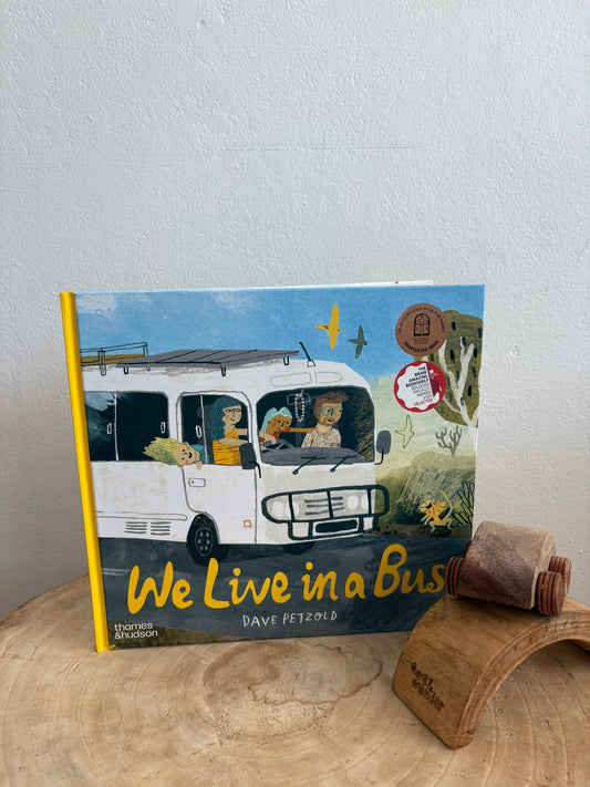 We Live In A Bus by Dave Petzold (Hard Back)