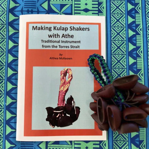 Kulap Shaker with blue cord on top of Making Kupal Shakers with Athe booklet